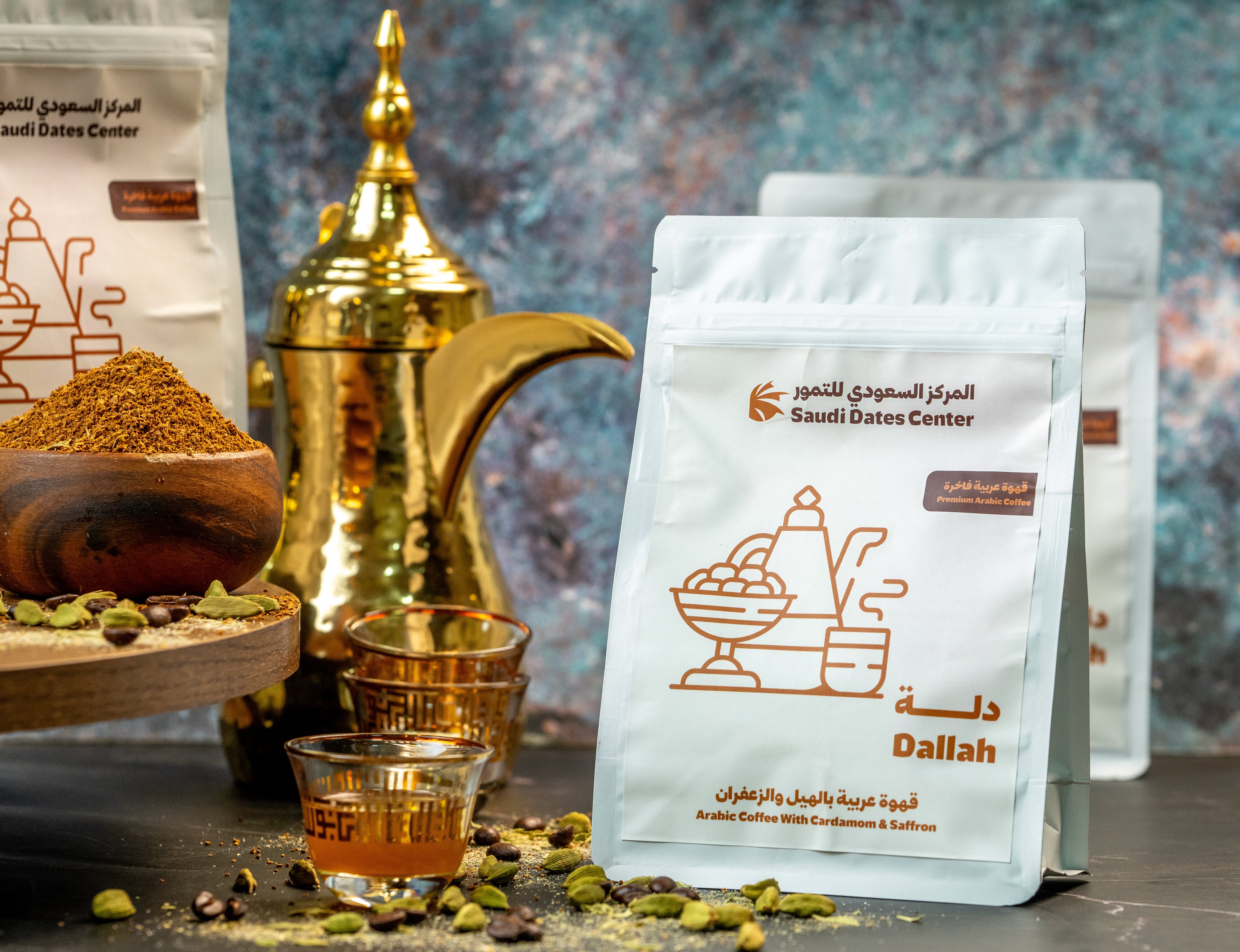 Packaging of Arabic coffee with an ornate coffee pot, spices, and dates on a rustic surface ready forproduct photoshoot