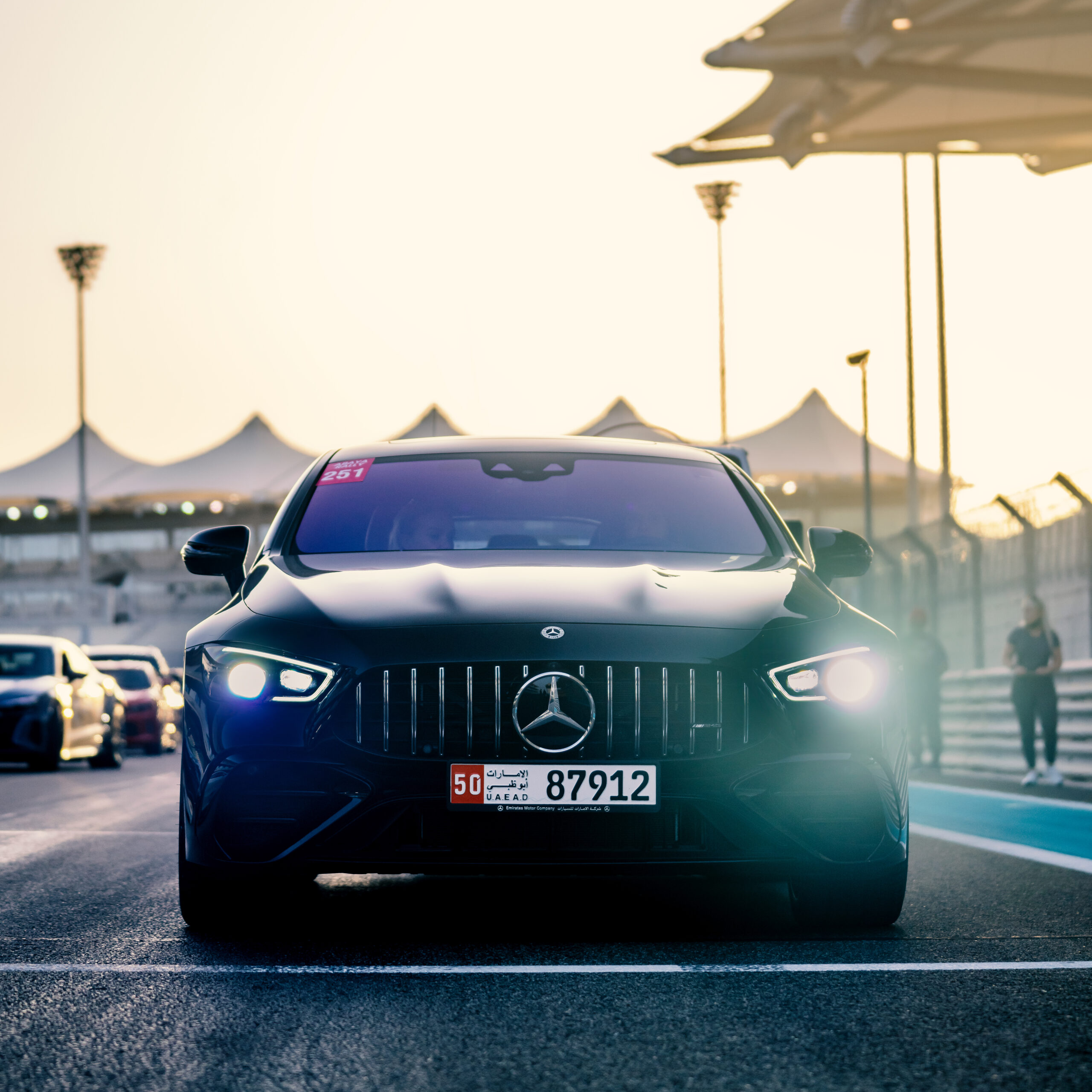 Three panelists seated onstage at the